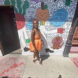 I’m selling this Pretty Little Thing Orange Halter Tie Dress